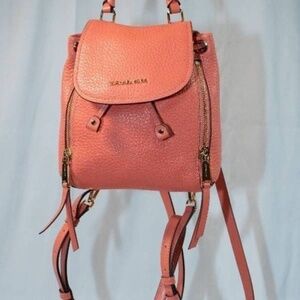 Michael Kors Viv Extra-Small Pebbled Leather Backpack. Orange.